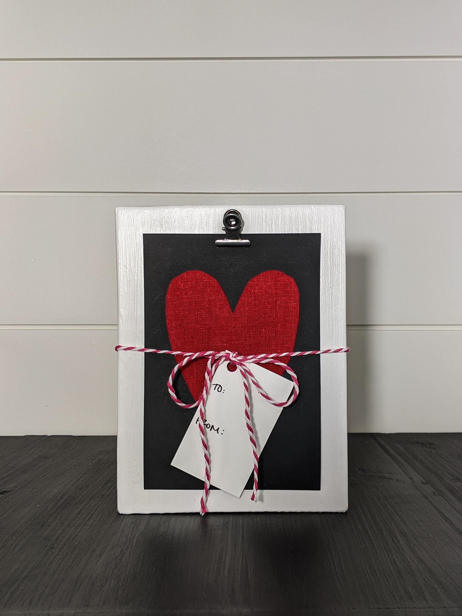 Wooden-clip-frame-with-heart-card-tied-with-a-bow