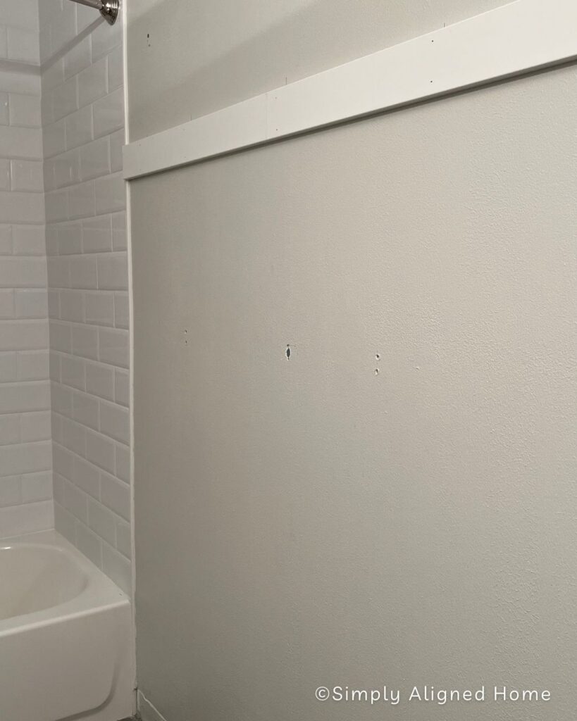Adding a 1x4 to the bathroom accent wall. 