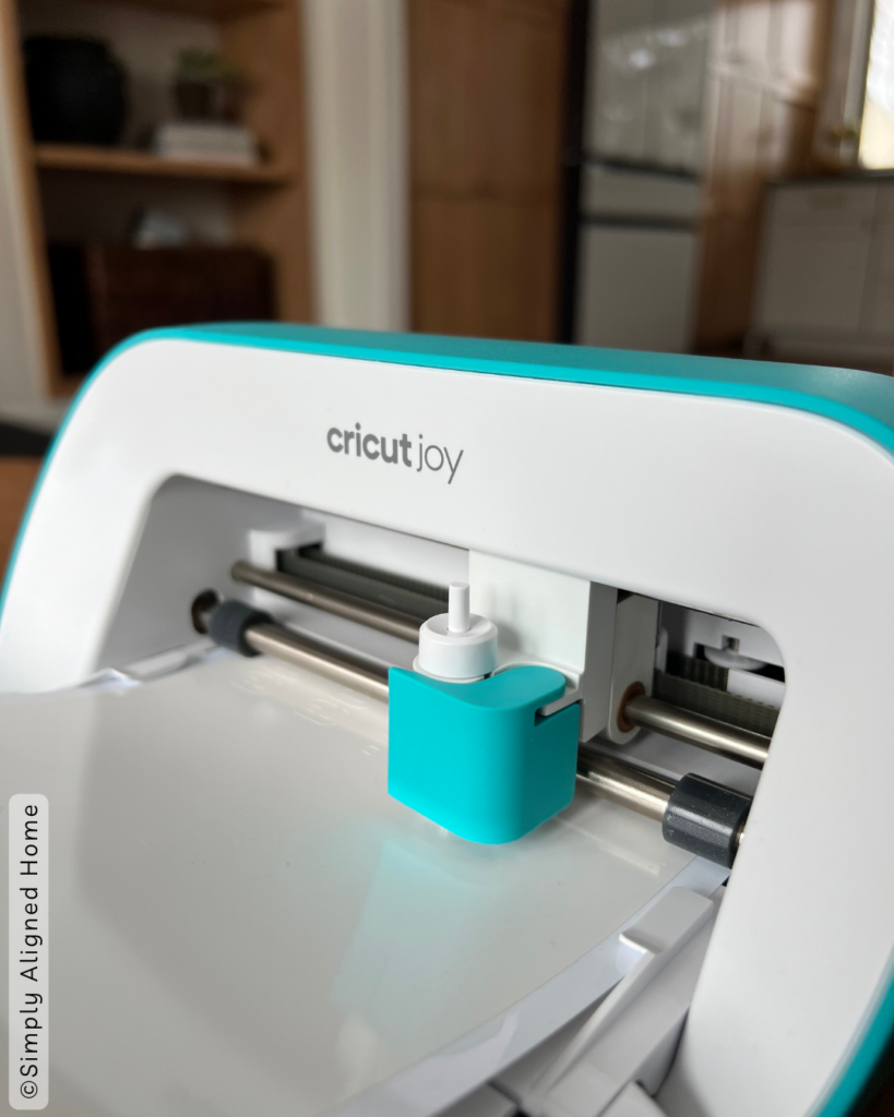 A cricut joy machine making labels for the totes. 