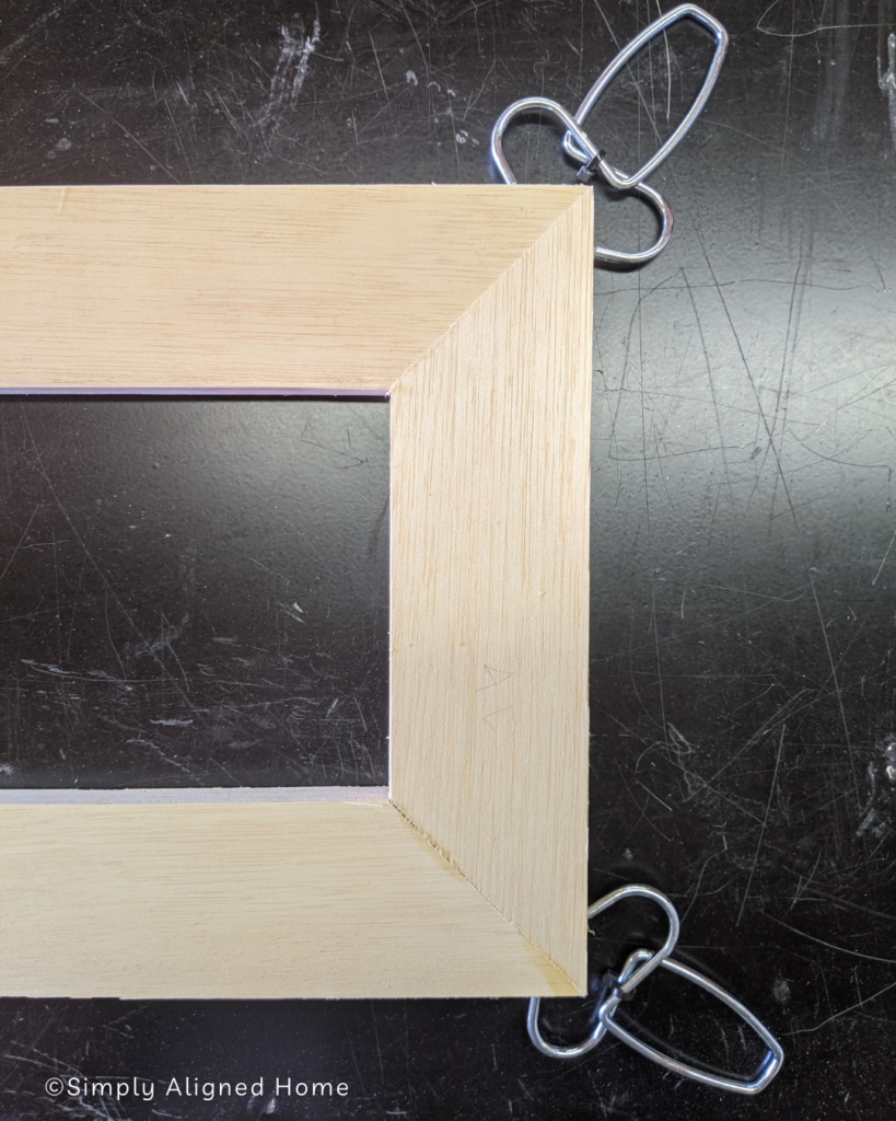 Corner clamps hold the face frame together for the drawers. 