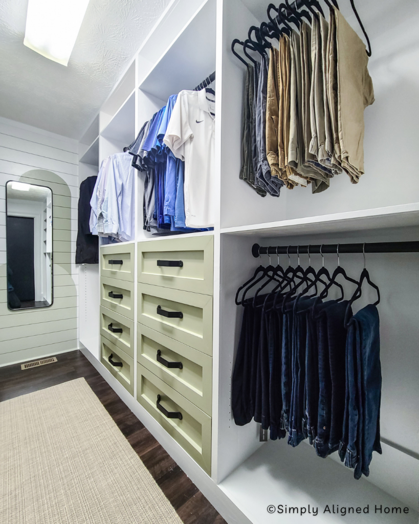 A neatly organized DIY custom closet featuring shelves, drawers, and hanging space, showcasing a successful home improvement project.