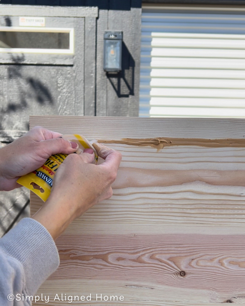 Using wood filler to fill seams. 