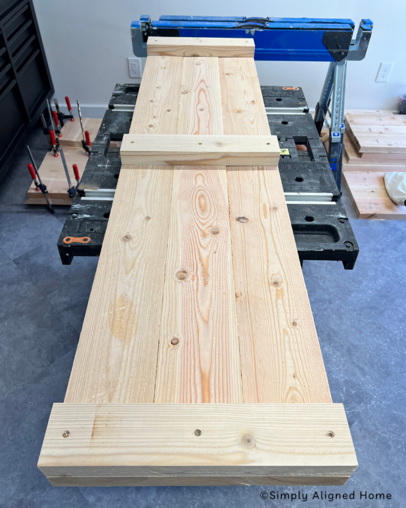 Adding feet supports to the coffee table. 